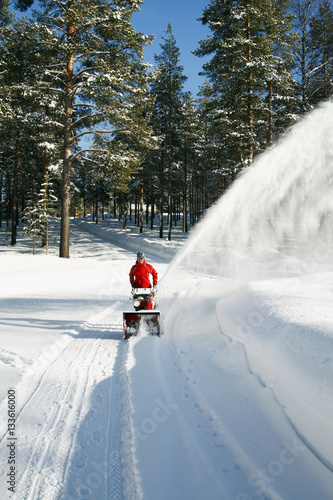 Person pulling snowplow photo