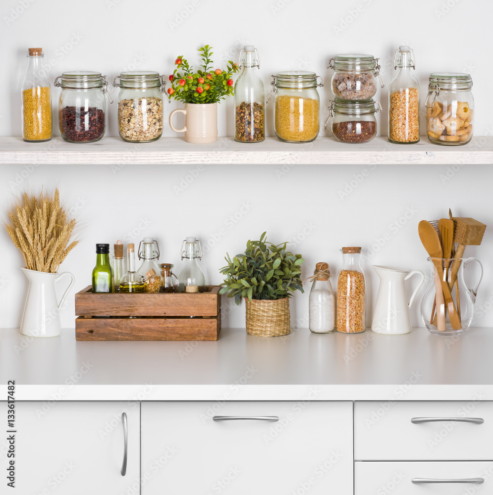 Kitchen bench shelves with various food ingredients on white background Kitchen bench shelves with various food ingredients on white background