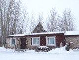 Russian Winter. Winter landscape. Cosy winter house. Morning. snowfall.