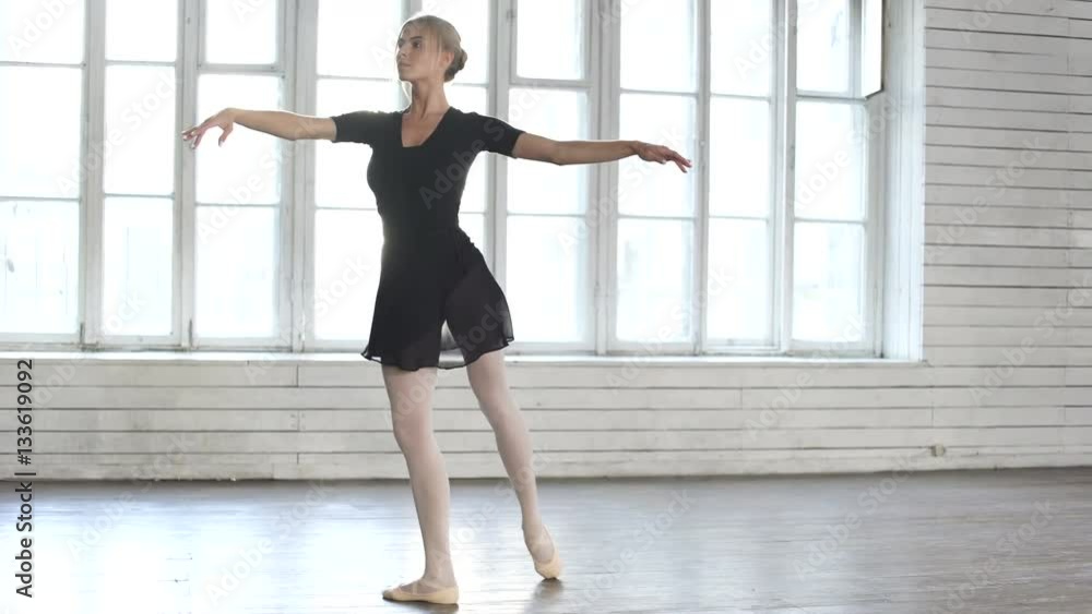 Ballerina dancing in ballet class. Full length Ballerina dancing in ballet class. Full length