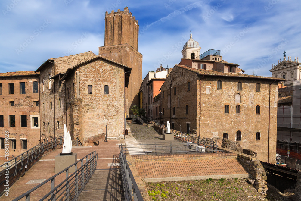 Rome, Italy. Tower of the Militia (about 1200) and the ancient buildings, adjacent to the Trajan's Market