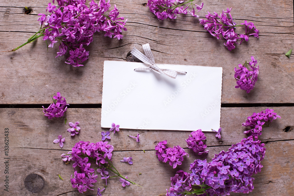 Fresh violet lilac flowers, decorative red heart and empty tag o Fresh violet lilac flowers, decorative red heart and empty tag o