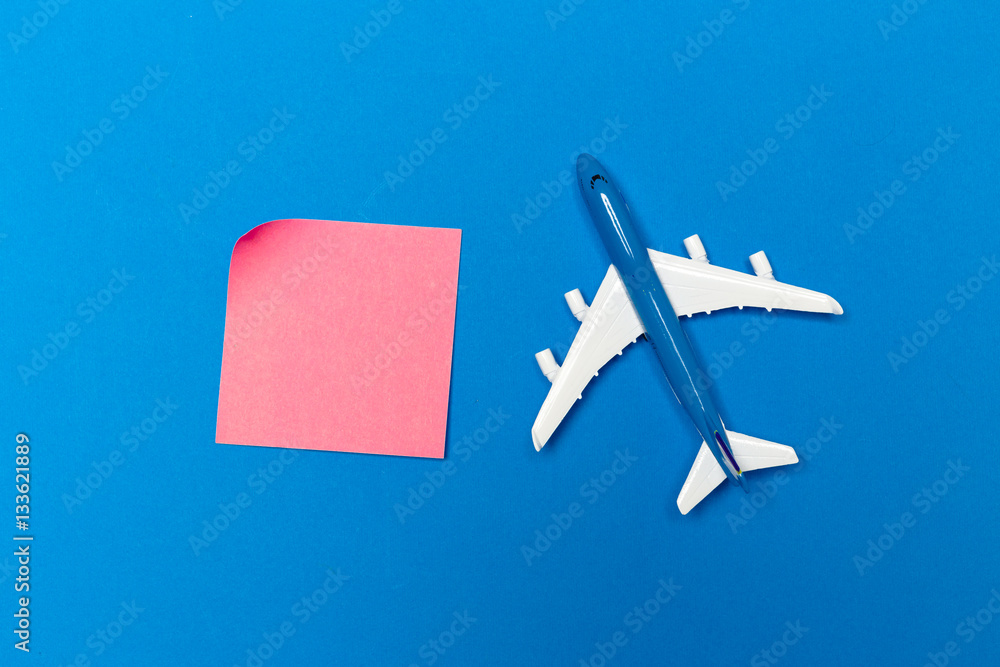 Fototapeta premium model of passenger plane on blue background