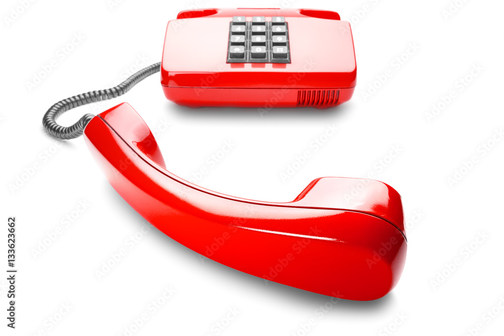 landline phone in red on a isolated white background landline phone in red on a isolated white background