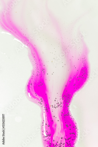 Water drops on glass on pink background