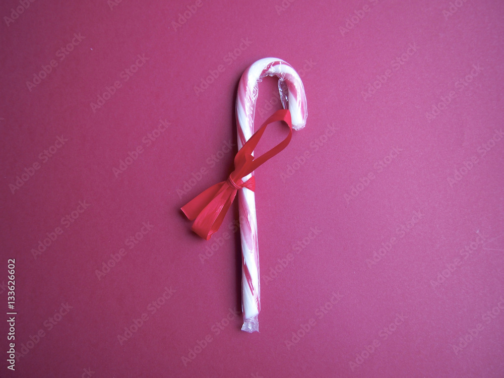 Candy cane on red background Candy cane on red background