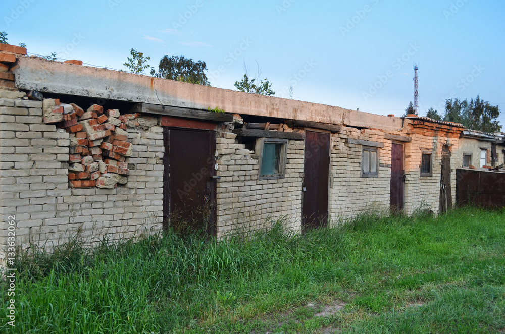 Old abandoned brick barn. Sunset Old abandoned brick barn. Sunset