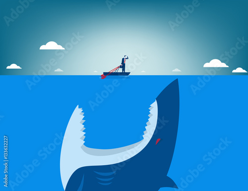 Risk. Shark attacking businessman