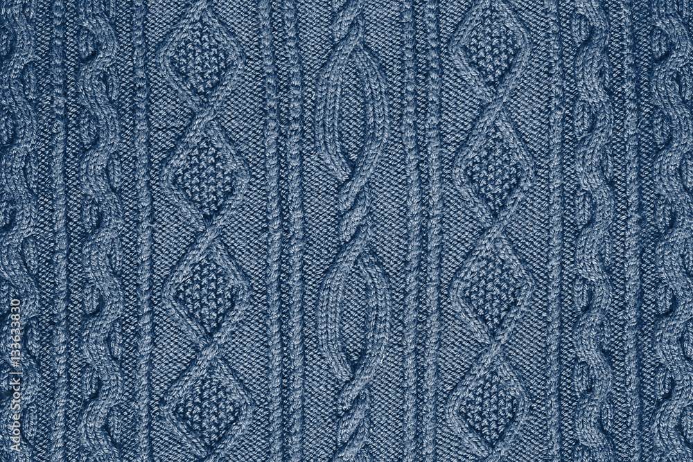 blue background patterned knitted fabric closeup