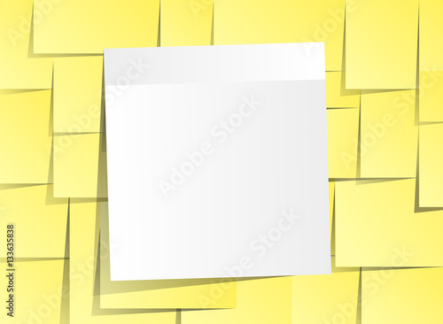 White stick note isolated on yellow background