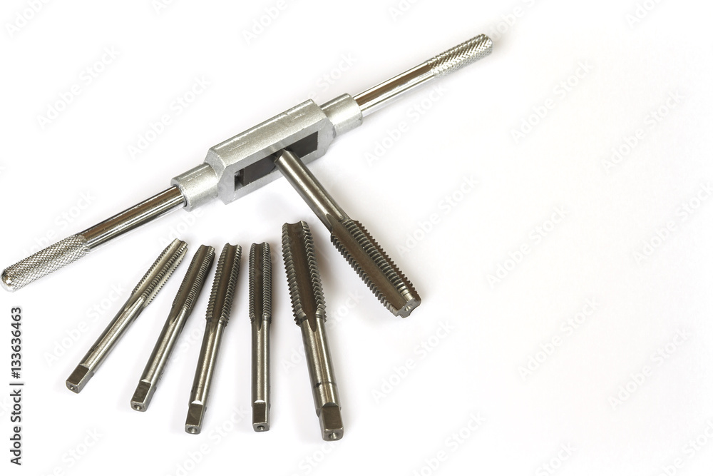 Mechanical hand tool set of screw tap and die cutting isolate on white background. Mechanical hand tool set of screw tap and die cutting isolate on white background.