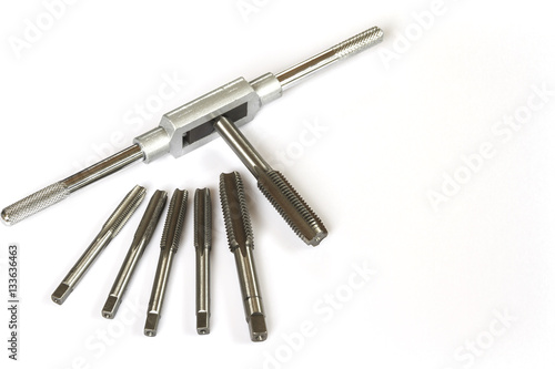 Mechanical hand tool set of screw tap and die cutting isolate on white background.