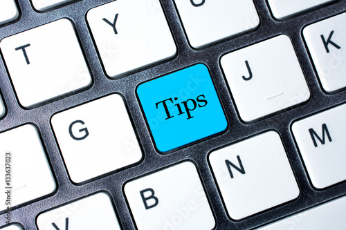 Tips button on white computer keyboard