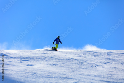 Male snowboarder on the slope