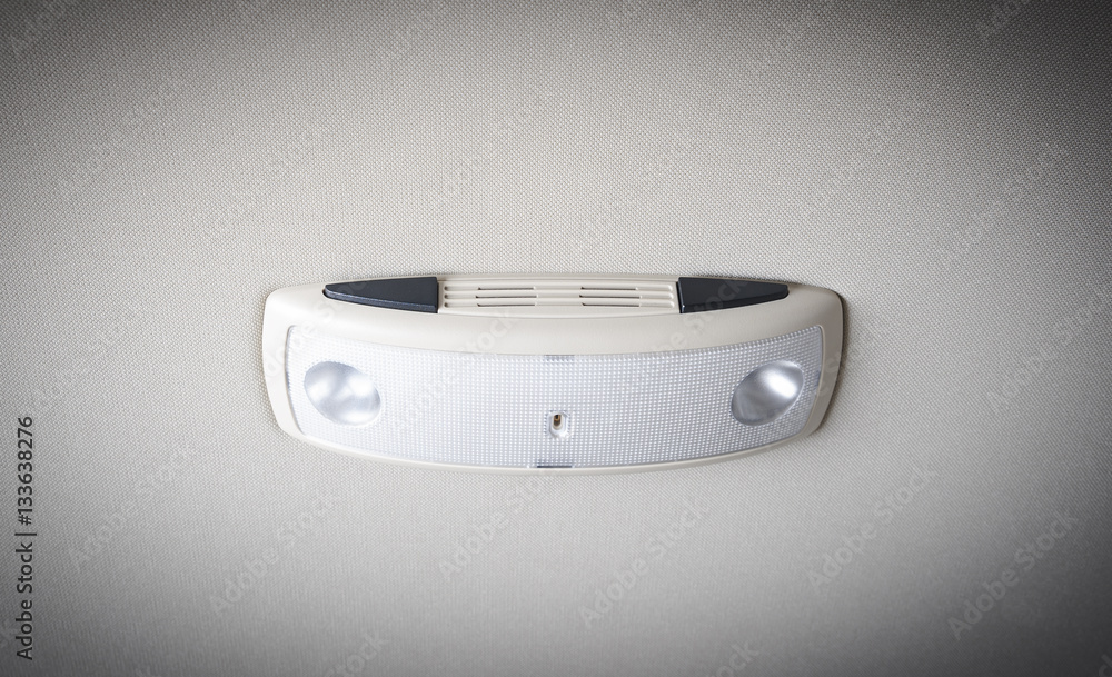 Car interior light panel on the top with buttons and lamp Car interior light panel on the top with buttons and lamp