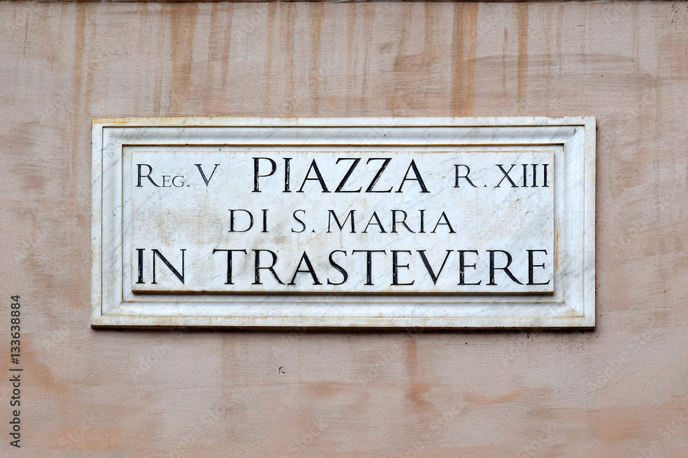 Piazza di S. Maria in Trastevere, street plate on a wall in Rome Piazza di S. Maria in Trastevere, street plate on a wall in Rome