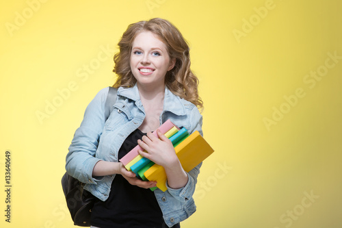 Young beautiful cheerful student girl