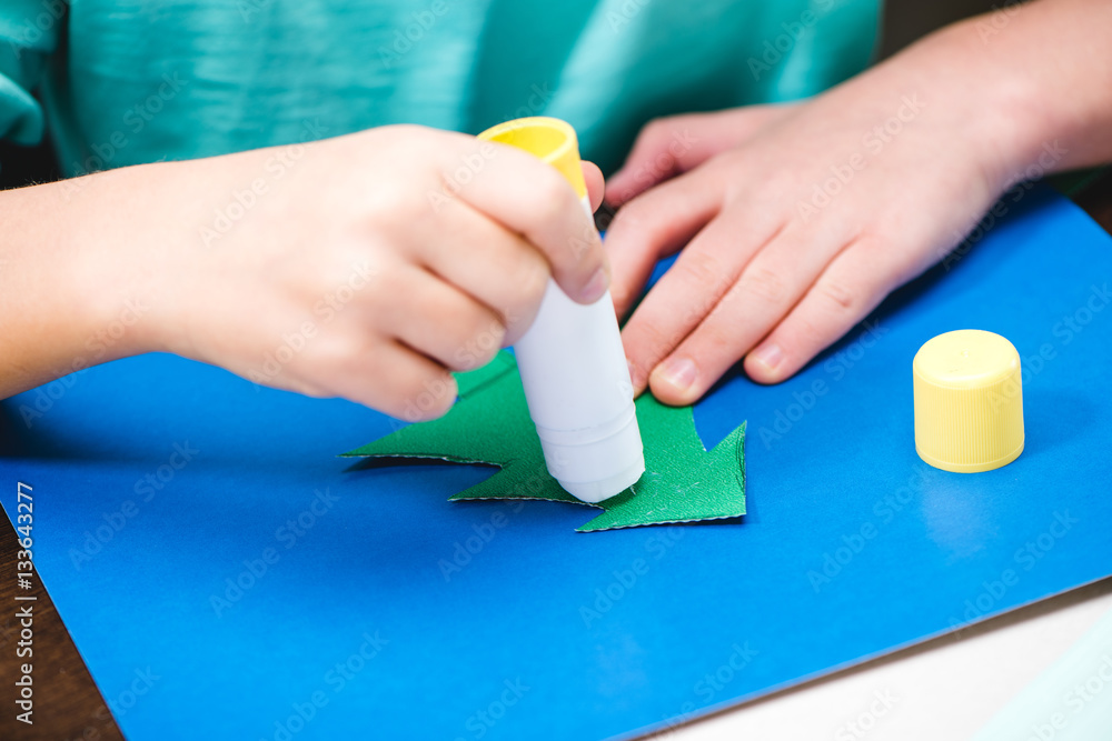 Child making christmas card Child making christmas card