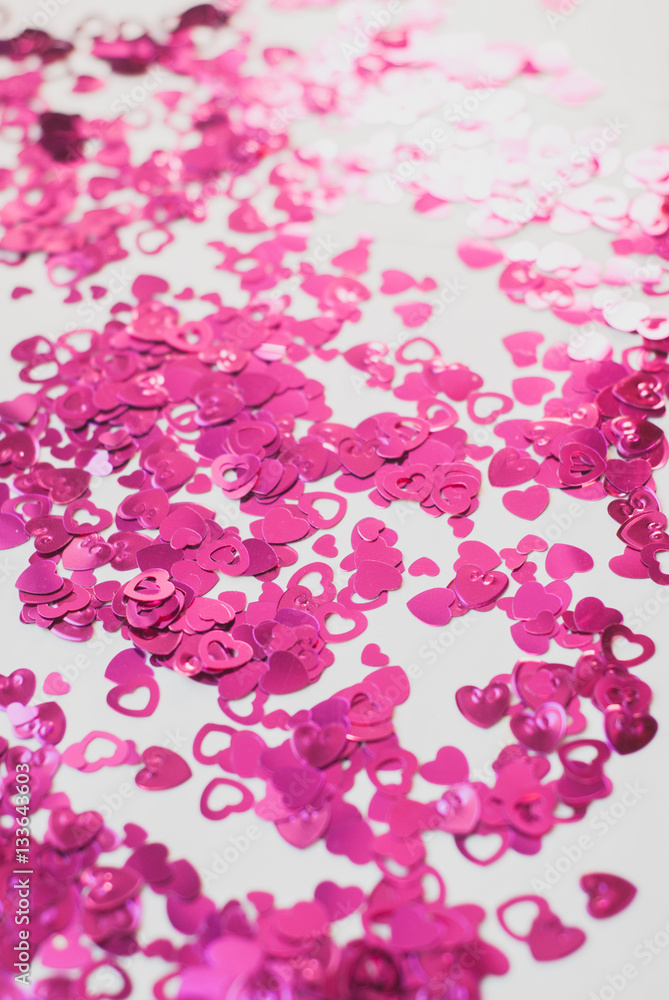 Obraz premium Confetti hearts on a white background,