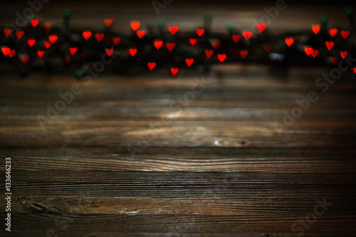 Heart bokeh, Valentine's day concept on wooden background