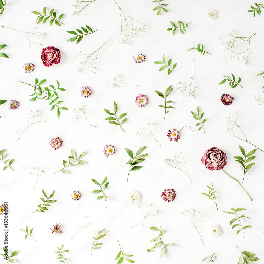 Floral texture. Pink roses and green leaves on white background. Flat lay, top view Floral texture. Pink roses and green leaves on white background. Flat lay, top view
