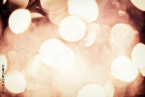Abstract background with golden bokeh.