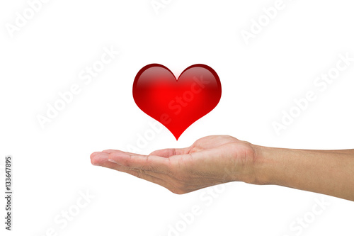 Man's hand holding red heart on white background