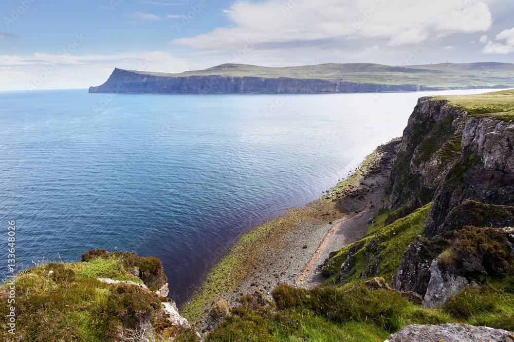 Cliffs and summit of Ben Skriaig across Loch Pooltiel near Dunvegan on the Isle of Skye, Scotland, UK.      