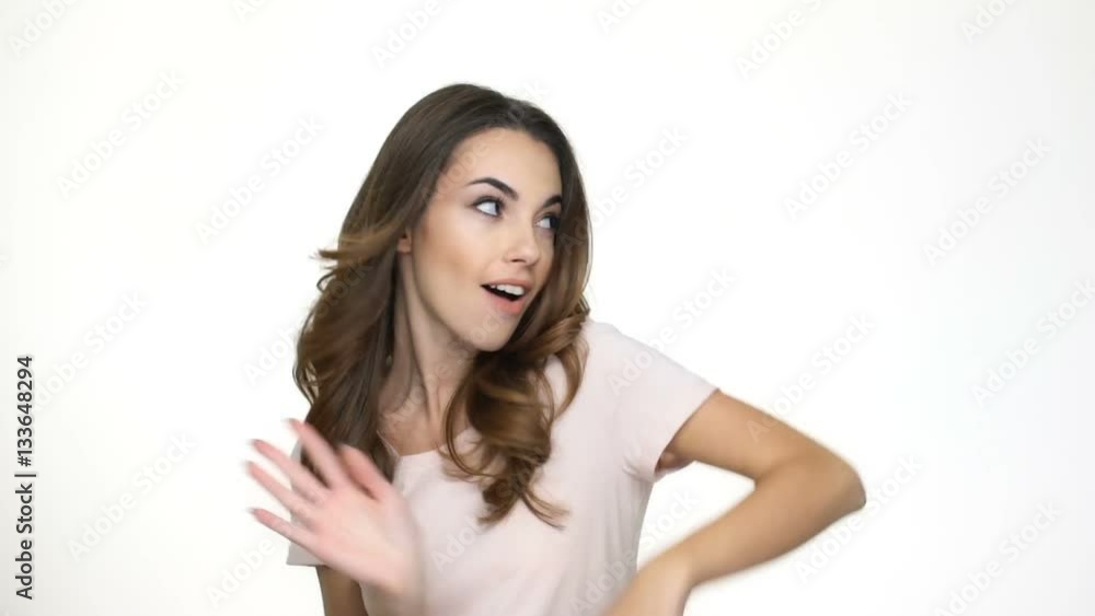 Cheerful funny girl dancing isolated on the white background Cheerful funny girl dancing isolated on the white background