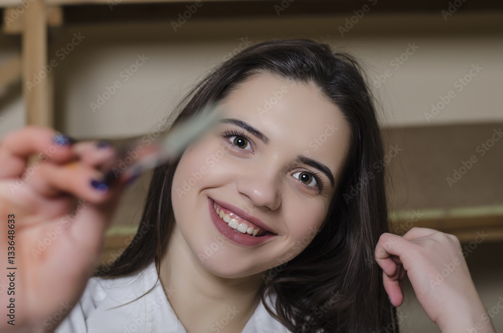 Fototapeta premium woman with a brush draws