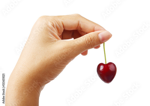 Hand holding cherry heart shape isolated clipping path