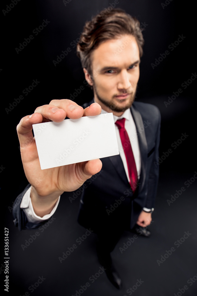 Businessman showing card Businessman showing card