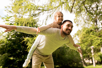 happy family having fun in summer park