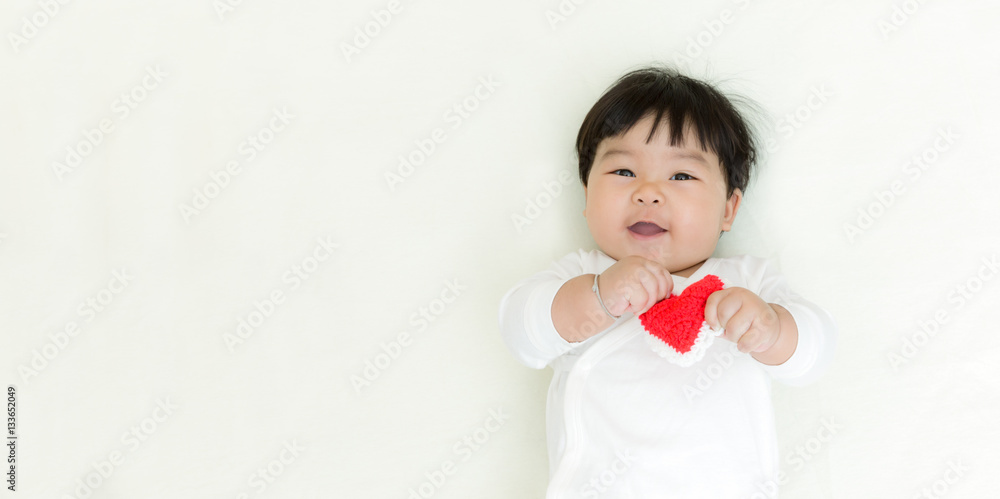Red heart with adorable asian baby girl for valentine concept background. Red heart with adorable asian baby girl for valentine concept background.