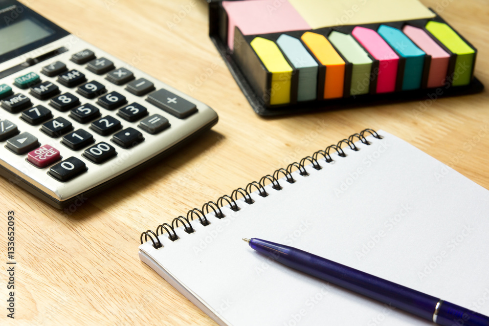 Blank note book with pen, calculator, memo background Blank note book with pen, calculator, memo background