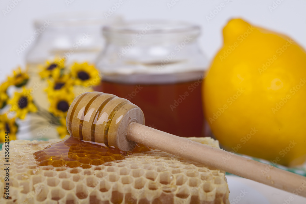 Honey in jar on a light background Honey in jar on a light background