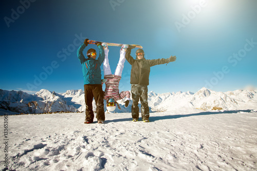 Group friends snowboarders have fun on the slope