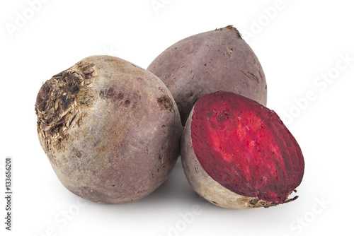 Whole red beetroots and one cut in half, isolated on white background