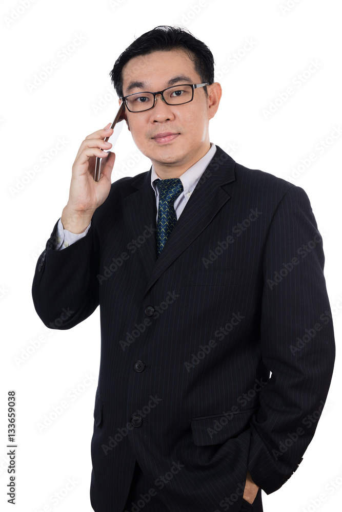 Smart Asian Chinese man wearing suit and holding mobile phone Smart Asian Chinese man wearing suit and holding mobile phone