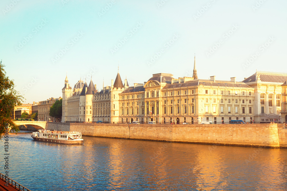 Obraz premium La Conciergerie - ex royal palace and prison at sunny summer day, Paris, France, retro toned