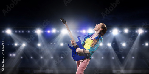 Rock musician at concert . Mixed media © Sergey Nivens