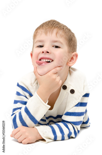 Obraz na plátně Portrait of cheerful handsome boy showing tongue