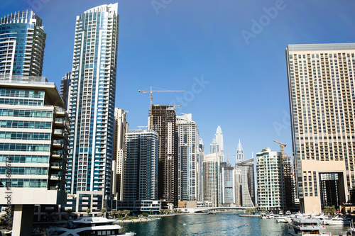 Tall skyscrapers built on both sides of the river in Dubai