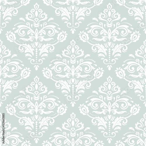 Elegant classic pattern. Seamless abstract background with repeating elements. Light blue and white pattern