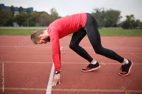Here we go! Athlete ready to start running from the start line.