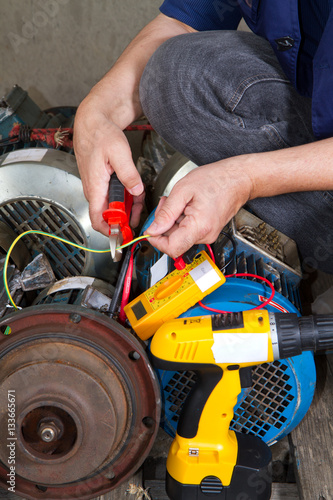 repairman during maintenance work of electric motors