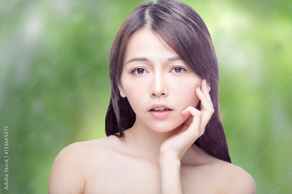 Asian beauty portrait on blurred greenery Asian beauty portrait on blurred greenery