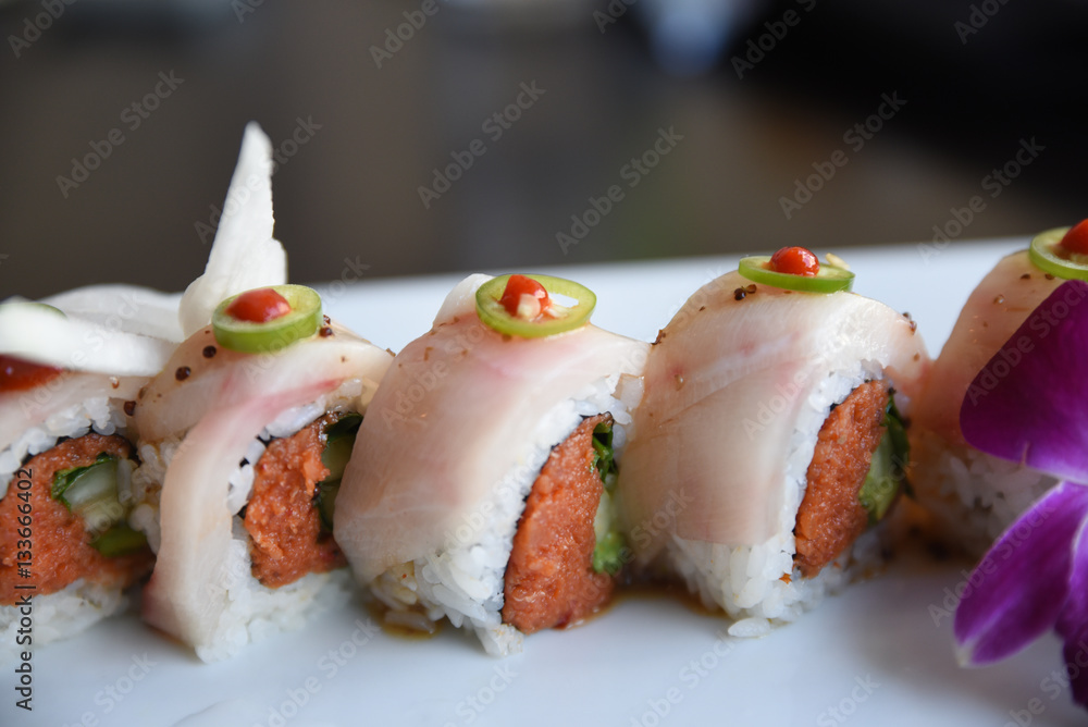 Fresh sushi on serving dish Fresh sushi on serving dish