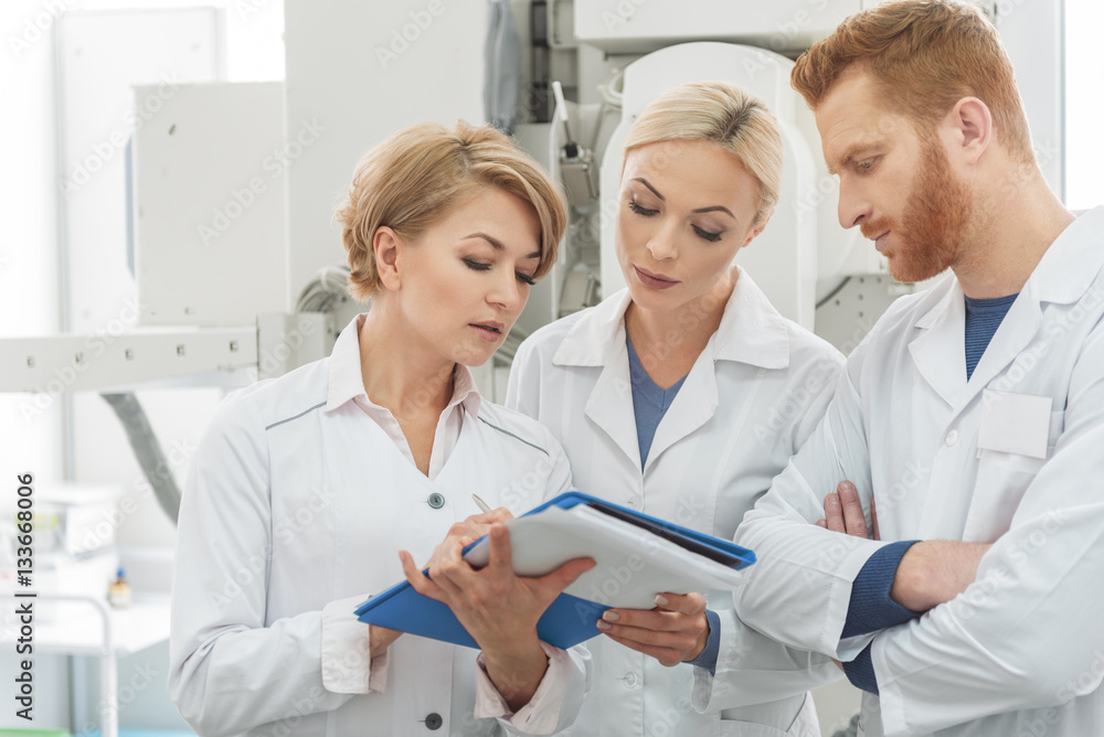 Serious doctors consult with each other Serious doctors consult with each other