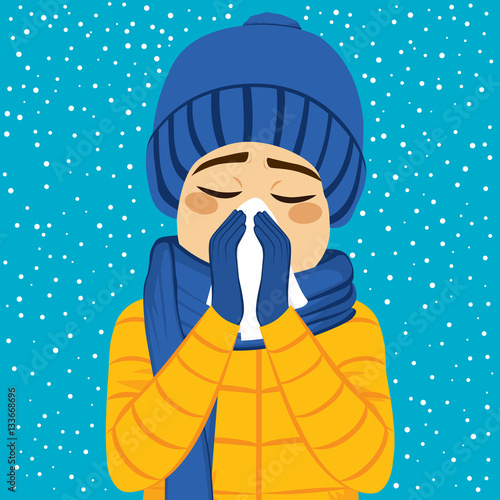 Young man having flu blowin...